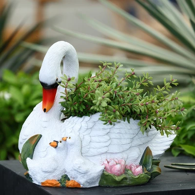 LuxenHome White Resin Swan Family Planter 1 LuxenHome White Resin Swan Family Planter